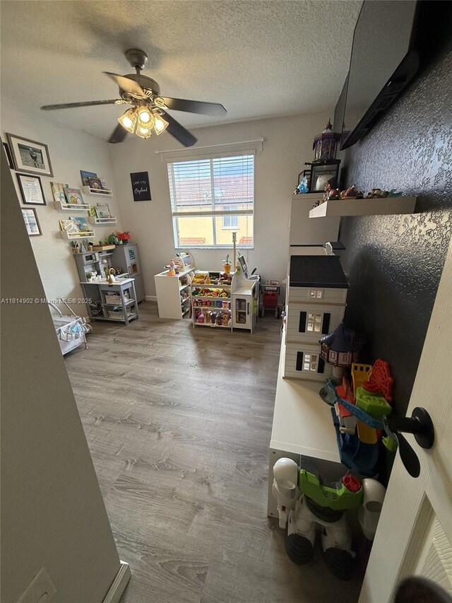 238 Magnolia Ave, Davie, FL 33325 - bedroom with wood finished floors, a textured ceiling, and a ceiling fan