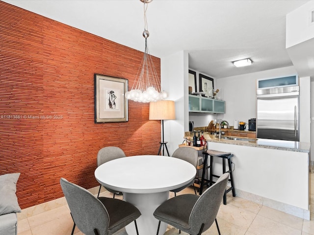 16275 Collins Ave Unit 2103, Sunny Isles Beach, FL 33160 - dining area with a chandelier and light tile patterned floors
