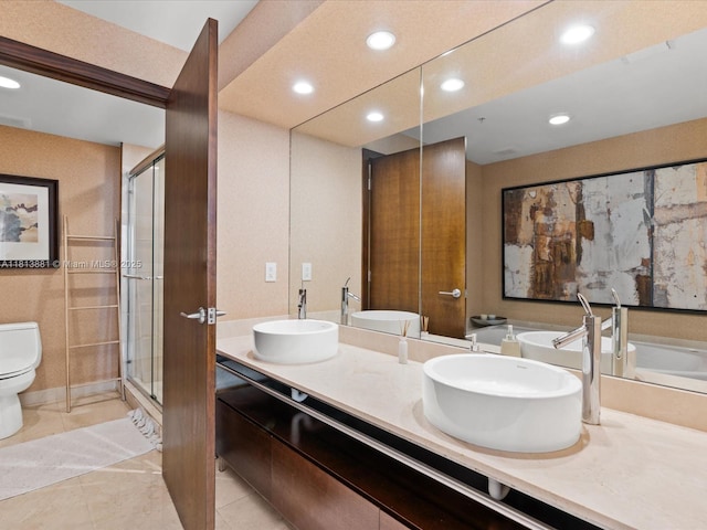 16275 Collins Ave Unit 2103, Sunny Isles Beach, FL 33160 - bathroom featuring toilet, recessed lighting, double vanity, a shower stall, and tile patterned flooring