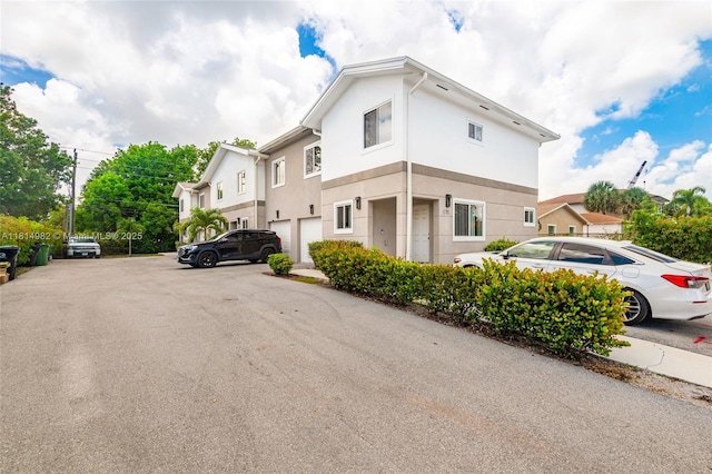 817 NW 3rd Ave, Fort Lauderdale, FL 33311 - view of side of property with stucco siding and uncovered parking