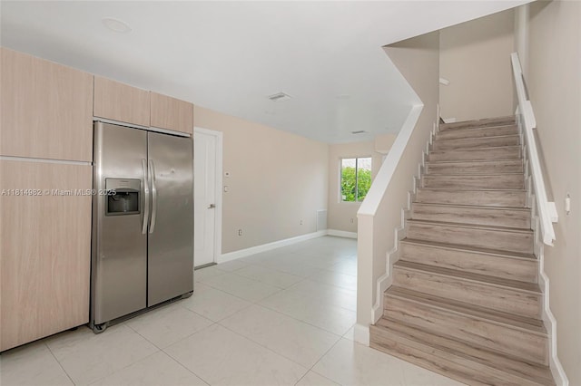 817 NW 3rd Ave, Fort Lauderdale, FL 33311 - staircase featuring tile patterned flooring and baseboards