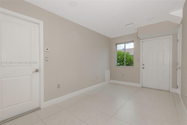817 NW 3rd Ave, Fort Lauderdale, FL 33311 - foyer entrance featuring baseboards and light tile patterned floors