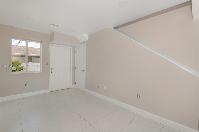 817 NW 3rd Ave, Fort Lauderdale, FL 33311 - spare room featuring baseboards and light tile patterned floors