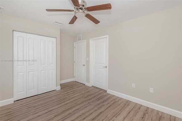 817 NW 3rd Ave, Fort Lauderdale, FL 33311 - unfurnished bedroom with wood finished floors, a closet, and a ceiling fan