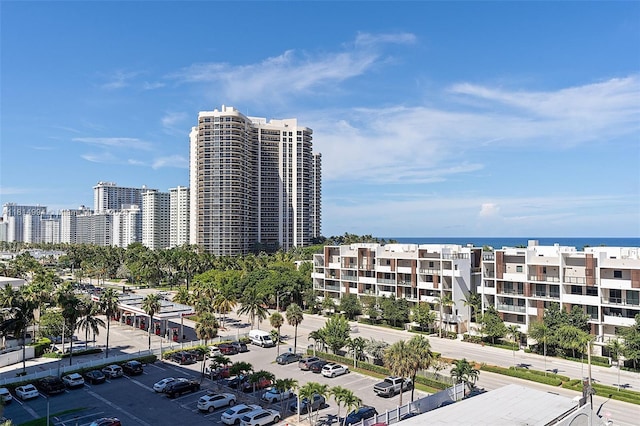 3015 N Ocean Blvd Unit 7D, Fort Lauderdale, FL 33308 - view of building exterior featuring uncovered parking, a city view, and a water view