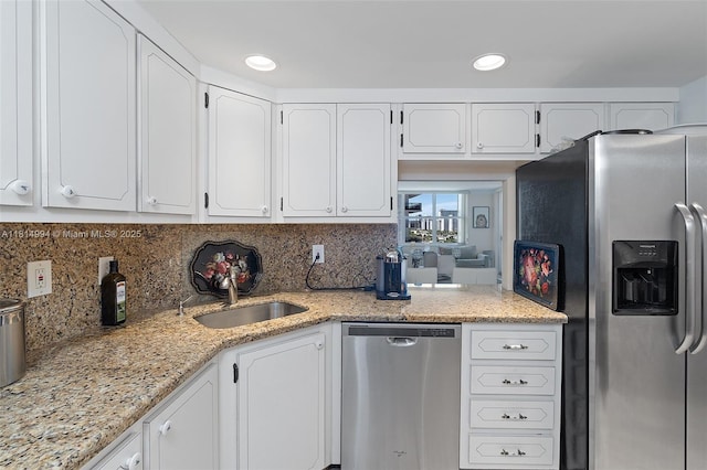 3015 N Ocean Blvd Unit 7D, Fort Lauderdale, FL 33308 - kitchen with stainless steel appliances, white cabinets, tasteful backsplash, and recessed lighting