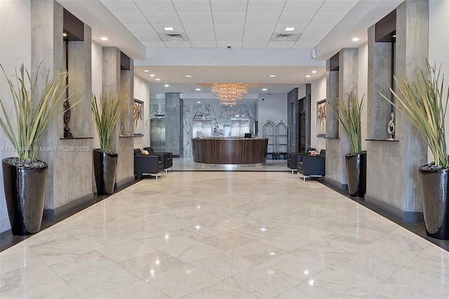 3015 N Ocean Blvd Unit 7D, Fort Lauderdale, FL 33308 - reception area with a chandelier and a drop ceiling