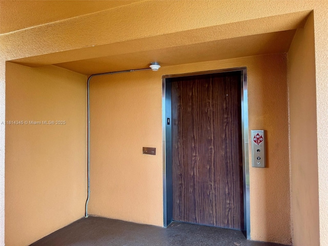 701 SW 142nd Ave Unit 414S, Pembroke Pines, FL 33027 - property entrance with stucco siding and elevator