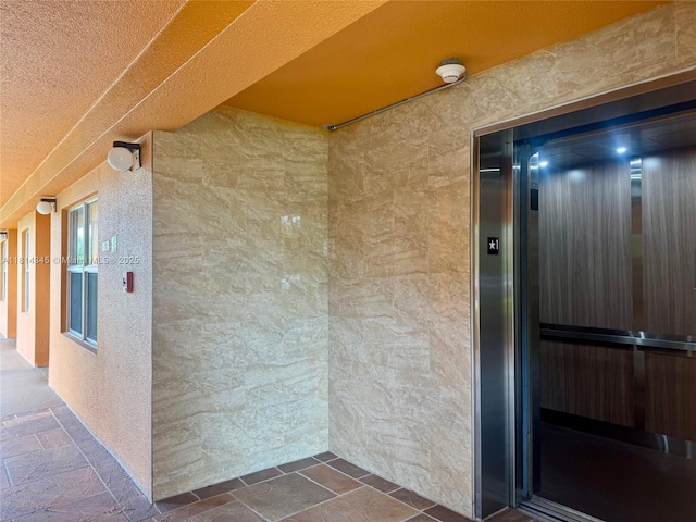 701 SW 142nd Ave Unit 414S, Pembroke Pines, FL 33027 - view of exterior entry featuring elevator