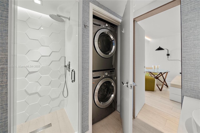 1500 Ocean Dr Unit 910, Miami Beach, FL 33139 - laundry room featuring stacked washer / dryer and light wood-style flooring