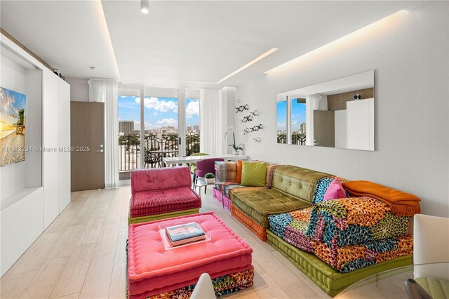 1500 Ocean Dr Unit 910, Miami Beach, FL 33139 - living room with light wood-style floors and floor to ceiling windows