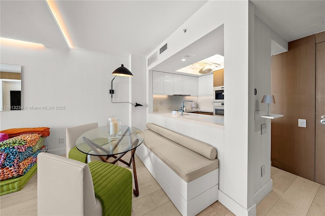 1500 Ocean Dr Unit 910, Miami Beach, FL 33139 - dining room with light wood-style flooring