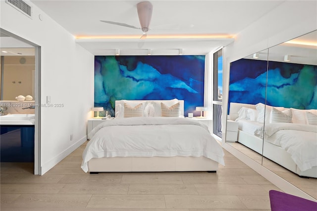 1500 Ocean Dr Unit 910, Miami Beach, FL 33139 - bedroom featuring wood finished floors, ceiling fan, a sink, and baseboards
