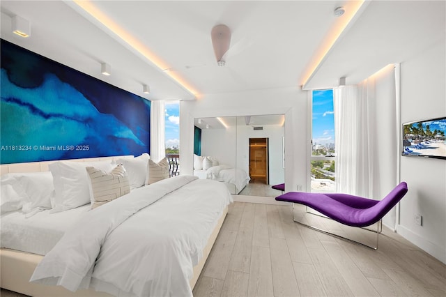 1500 Ocean Dr Unit 910, Miami Beach, FL 33139 - bedroom featuring wood finished floors, a wall of windows, and baseboards