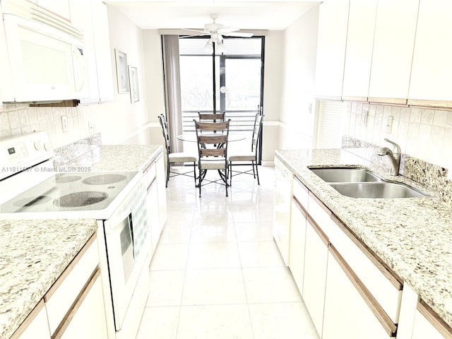 1470 Sheridan St Unit 18C, Hollywood, FL 33020 - kitchen featuring white appliances, a sink, tasteful backsplash, and ceiling fan