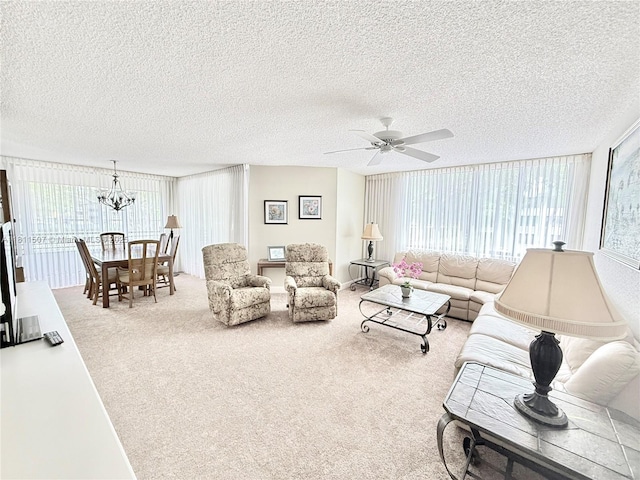 1470 Sheridan St Unit 18C, Hollywood, FL 33020 - carpeted living area with ceiling fan, a textured ceiling, and a chandelier