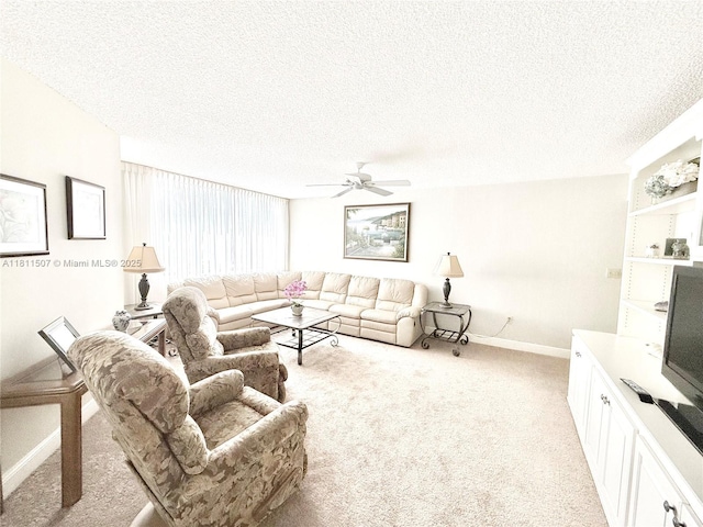 1470 Sheridan St Unit 18C, Hollywood, FL 33020 - living area with light colored carpet, a ceiling fan, baseboards, and a textured ceiling