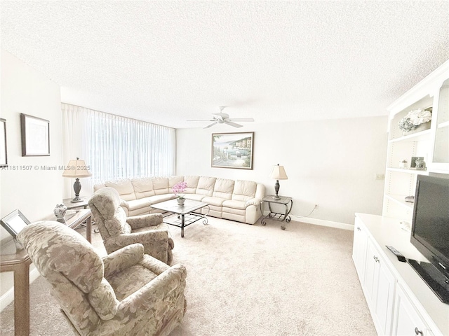 1470 Sheridan St Unit 18C, Hollywood, FL 33020 - living room featuring a textured ceiling, ceiling fan, light carpet, and baseboards