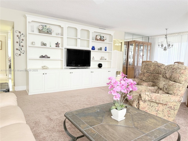 1470 Sheridan St Unit 18C, Hollywood, FL 33020 - living area with light colored carpet, a textured ceiling, and a chandelier