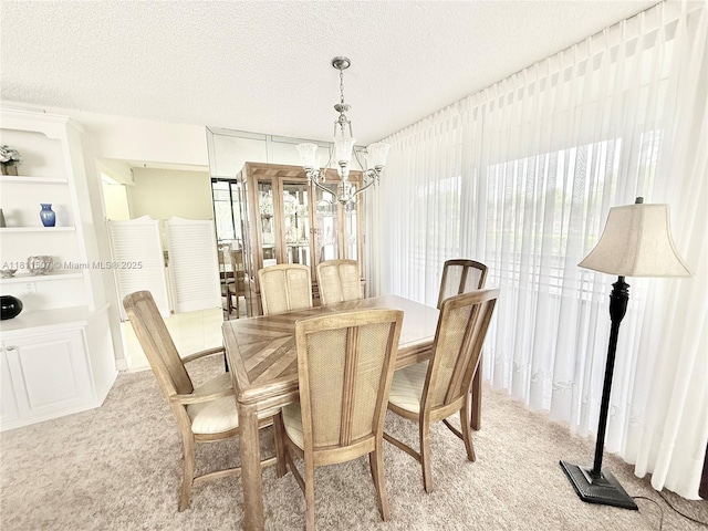 1470 Sheridan St Unit 18C, Hollywood, FL 33020 - dining space with a chandelier, light colored carpet, and a textured ceiling