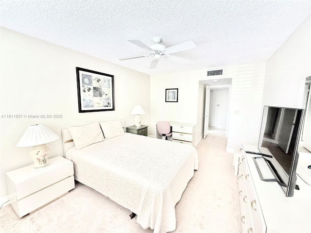 1470 Sheridan St Unit 18C, Hollywood, FL 33020 - bedroom featuring a textured ceiling, ceiling fan, baseboards, and light carpet