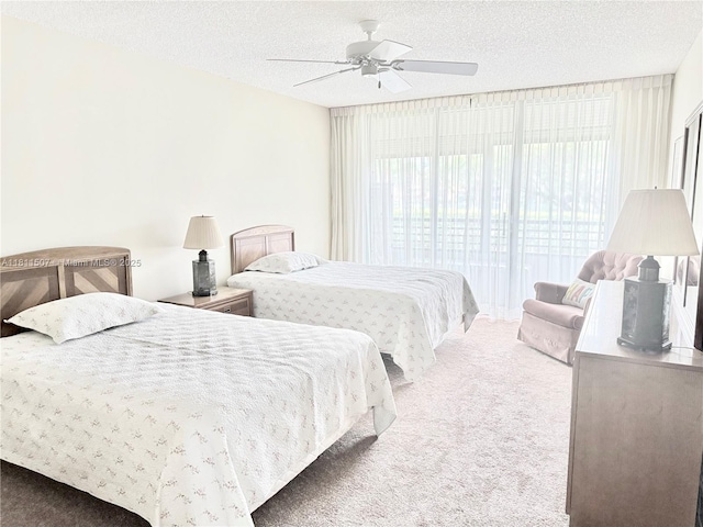 1470 Sheridan St Unit 18C, Hollywood, FL 33020 - carpeted bedroom featuring a textured ceiling and ceiling fan