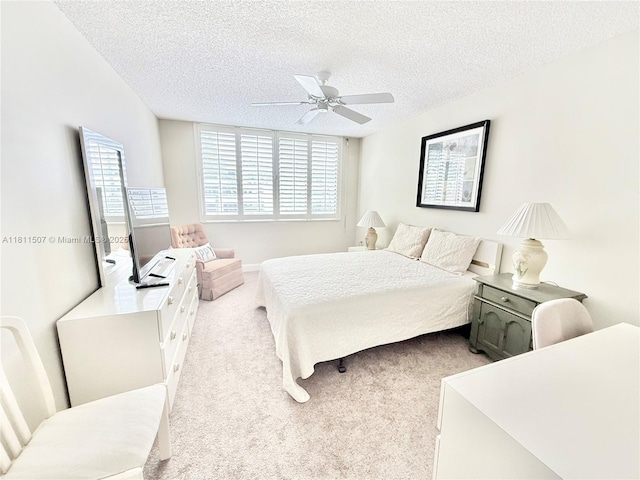 1470 Sheridan St Unit 18C, Hollywood, FL 33020 - bedroom with a textured ceiling, carpet floors, and a ceiling fan