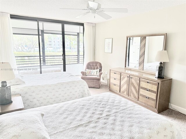 1470 Sheridan St Unit 18C, Hollywood, FL 33020 - carpeted bedroom with baseboards, access to exterior, and a ceiling fan