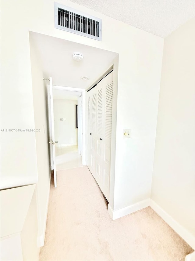 1470 Sheridan St Unit 18C, Hollywood, FL 33020 - hall with light carpet and baseboards
