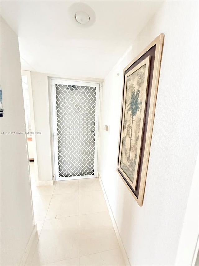 1470 Sheridan St Unit 18C, Hollywood, FL 33020 - corridor with baseboards and light tile patterned floors