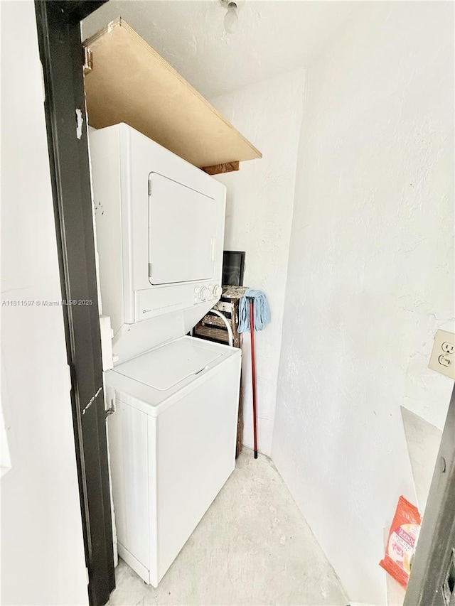 1470 Sheridan St Unit 18C, Hollywood, FL 33020 - washroom featuring stacked washing machine and dryer