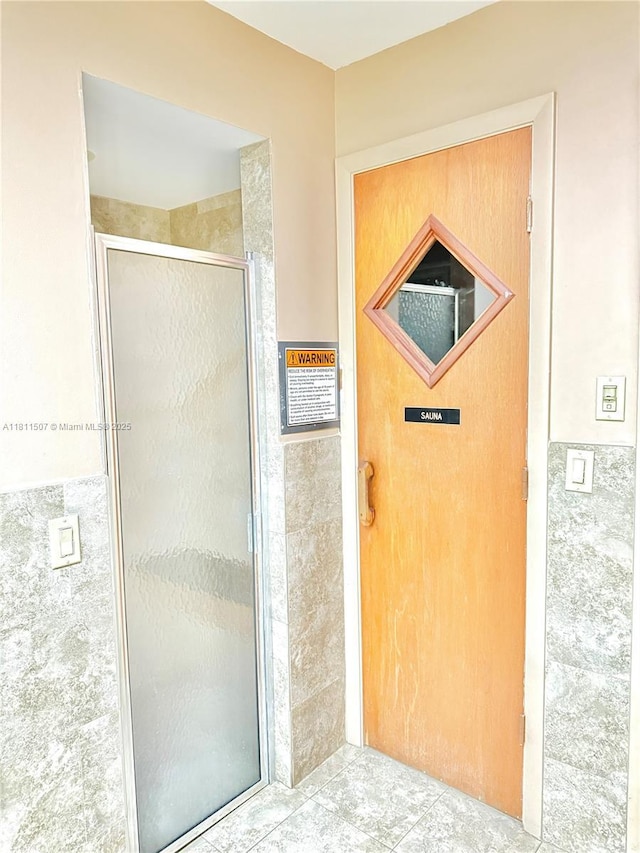 1470 Sheridan St Unit 18C, Hollywood, FL 33020 - full bathroom featuring a stall shower and tile patterned flooring