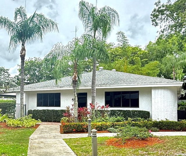 1470 Sheridan St Unit 18C, Hollywood, FL 33020 - view of front facade featuring stucco siding and a shingled roof