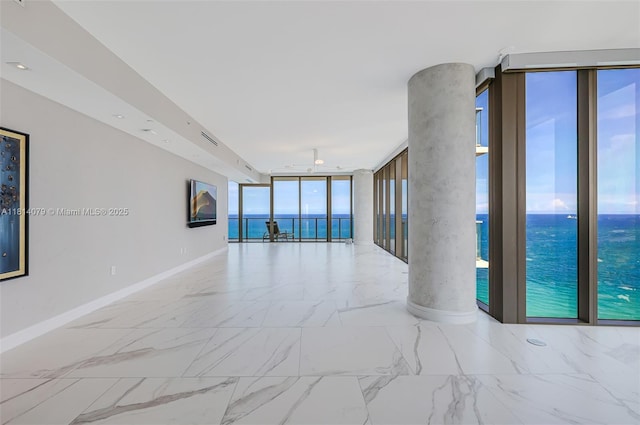 2200 N Ocean Blvd Unit S1801, Fort Lauderdale, FL 33305 - spare room with a wall of windows, baseboards, and marble finish floors