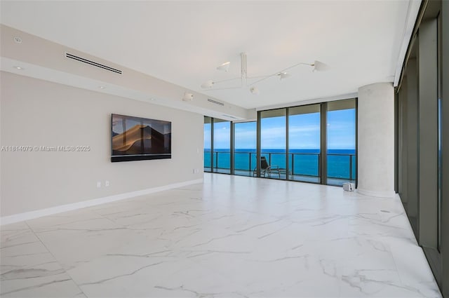 2200 N Ocean Blvd Unit S1801, Fort Lauderdale, FL 33305 - spare room featuring floor to ceiling windows, a water view, baseboards, and marble finish floors