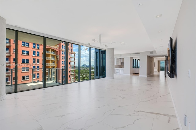 2200 N Ocean Blvd Unit S1801, Fort Lauderdale, FL 33305 - unfurnished room featuring a wall of windows, baseboards, and marble finish flooring