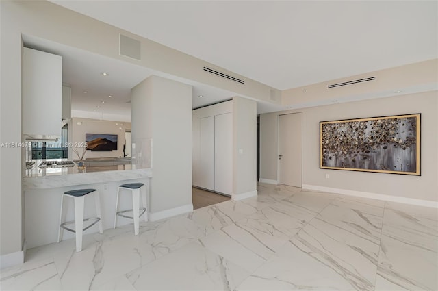 2200 N Ocean Blvd Unit S1801, Fort Lauderdale, FL 33305 - unfurnished living room featuring baseboards and marble finish flooring