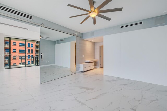 2200 N Ocean Blvd Unit S1801, Fort Lauderdale, FL 33305 - spare room featuring ceiling fan and marble tiled flooring