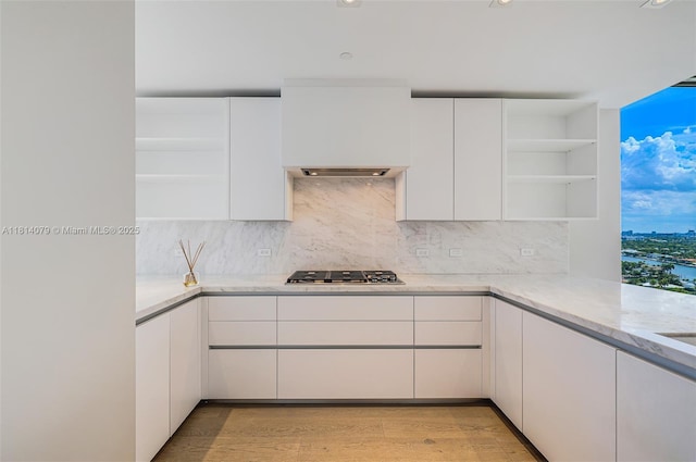 2200 N Ocean Blvd Unit S1801, Fort Lauderdale, FL 33305 - kitchen featuring open shelves, stainless steel gas cooktop, white cabinetry, light stone countertops, and recessed lighting