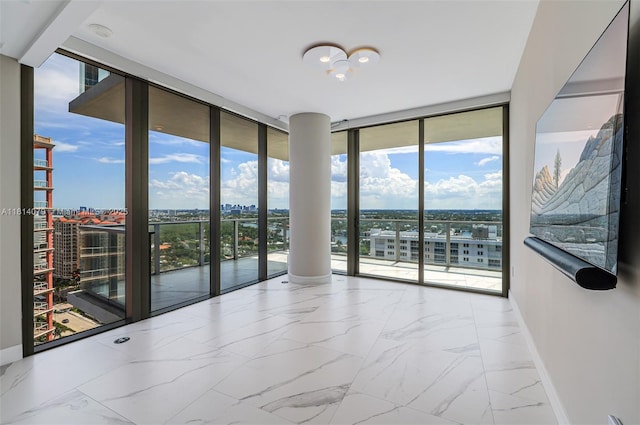 2200 N Ocean Blvd Unit S1801, Fort Lauderdale, FL 33305 - empty room featuring expansive windows, baseboards, healthy amount of natural light, a view of city, and marble finish flooring