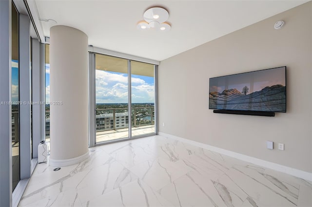 2200 N Ocean Blvd Unit S1801, Fort Lauderdale, FL 33305 - spare room featuring floor to ceiling windows, baseboards, light marble finish floors, decorative columns, and a smoke detector