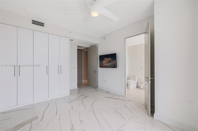 2200 N Ocean Blvd Unit S1801, Fort Lauderdale, FL 33305 - unfurnished bedroom with light marble finish floors, baseboards, ensuite bath, a closet, and ceiling fan