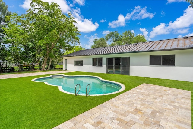 5311 SW 196th Ln, Southwest Ranches, FL 33332 - back of house featuring a standing seam roof, stucco siding, a patio area, and metal roof