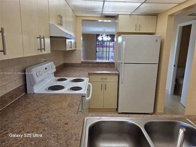 4102 W 10th Ln Unit 28, Hialeah, FL 33012 - kitchen featuring white appliances, under cabinet range hood, a sink, decorative backsplash, and a chandelier