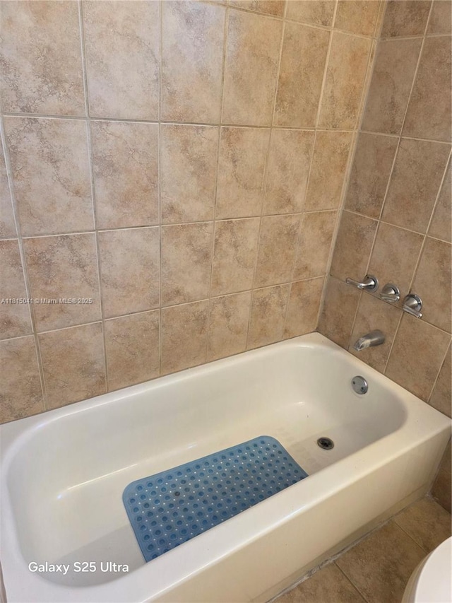4102 W 10th Ln Unit 28, Hialeah, FL 33012 - bathroom featuring toilet, a bath, and a shower