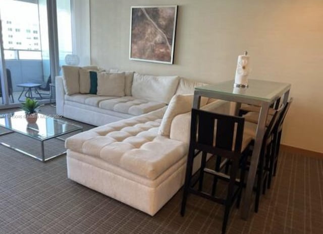1395 Brickell Ave Unit 2814, Miami, FL 33131 - living room featuring dark carpet and baseboards