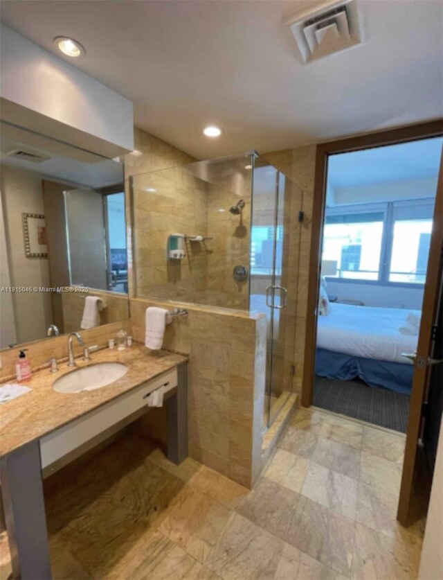 1395 Brickell Ave Unit 2814, Miami, FL 33131 - full bathroom featuring vanity, a shower stall, and recessed lighting