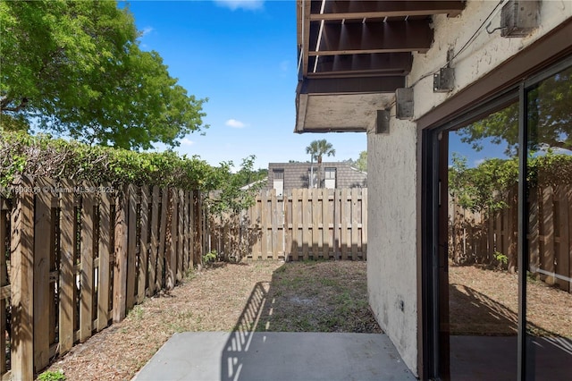 4020 Palm Bay Cir Unit B, West Palm Beach, FL 33406 - fenced backyard with a patio