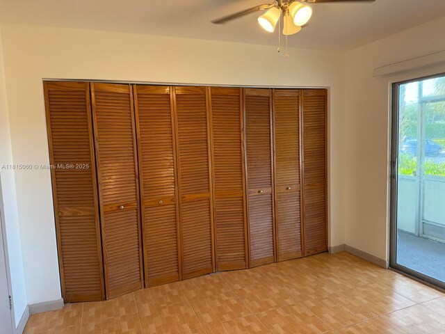 217 Suffolk F Unit 217, Boca Raton, FL 33434 - unfurnished bedroom featuring a closet, baseboards, and a ceiling fan