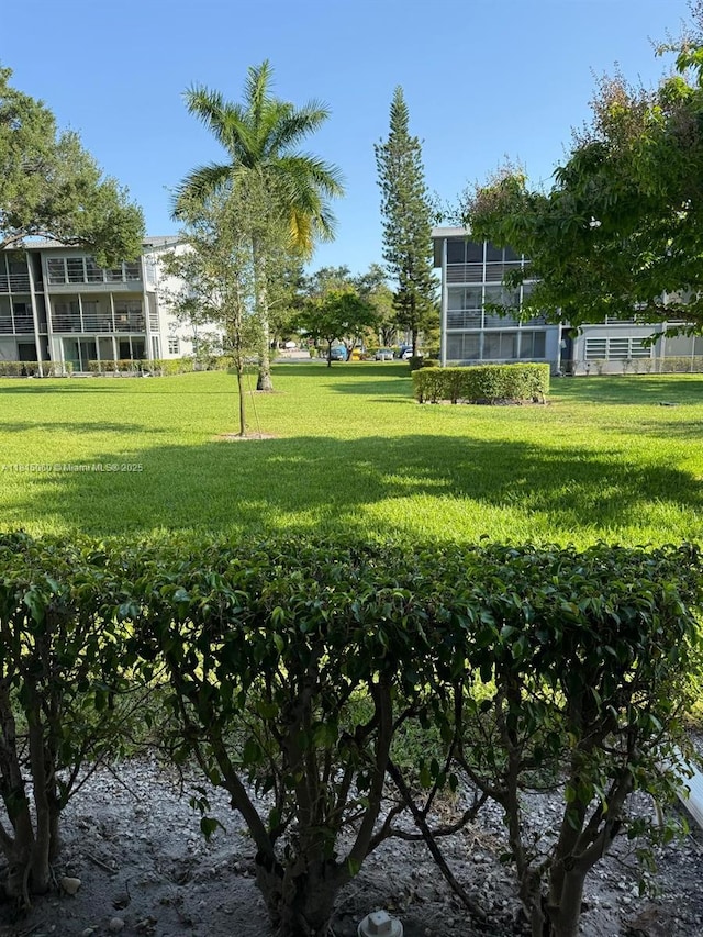 217 Suffolk F Unit 217, Boca Raton, FL 33434 - view of property's community featuring a lawn